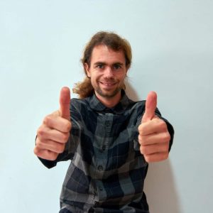 man in blue and white plaid button up shirt